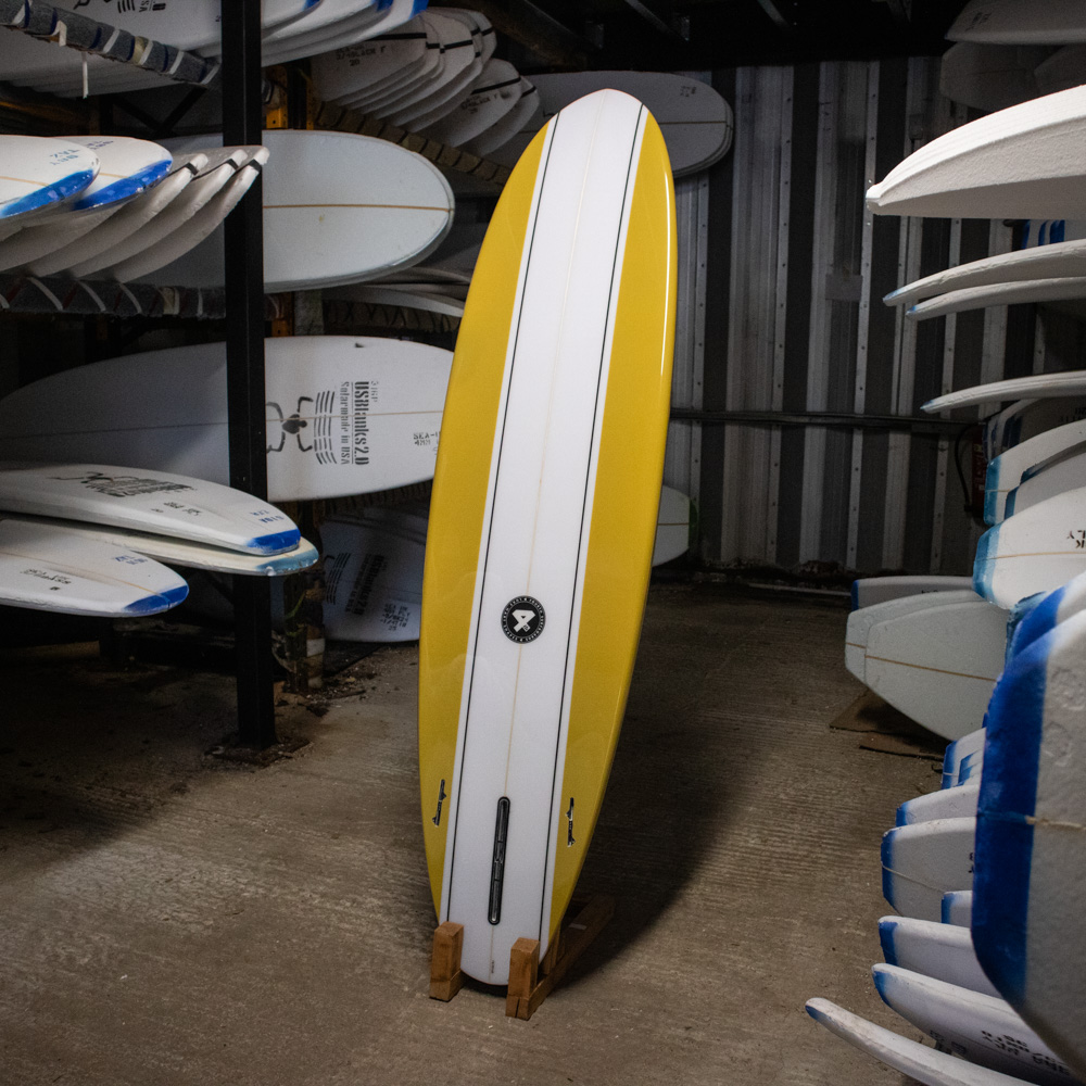 Fourth time piece mid length surfboard - back